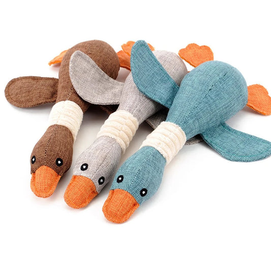 Three adorable plush duck toys in brown, gray, and teal with charming details, perfect as soft play companions for children or unique gifts for duck enthusiasts.